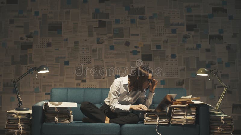 Businesswoman working on the sofa late at night