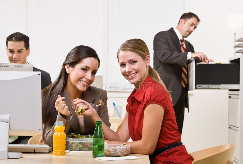 Businesswomen eating salad for lunch stock photo Businesswomen eating salad for lunch stock photo