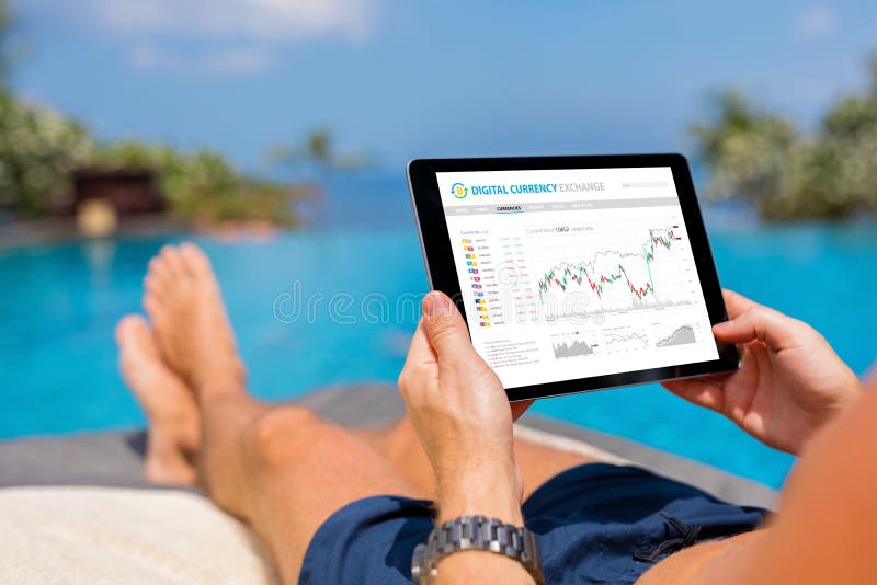 Man trading digital currencies online while relaxing by the pool. royalty free stock photos