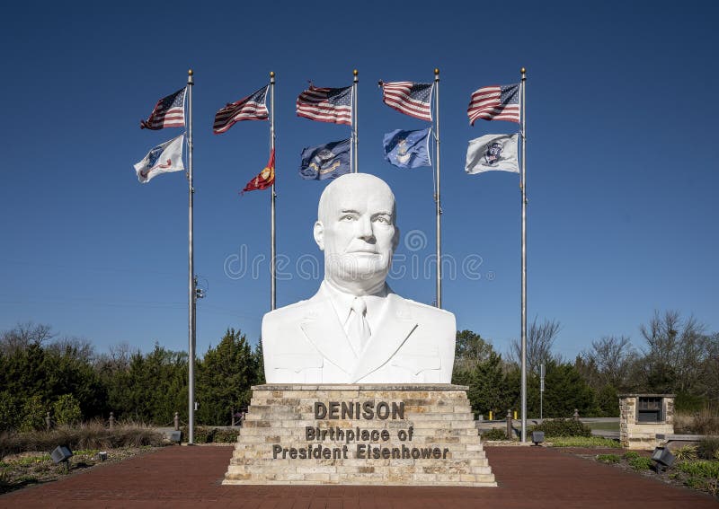 Pictured is a seventeen foot tall bust of General Dwight David Eisenhower, 34th President of the United States.  The artist is David Adickes who has done busts for all forty-four United States Presidents.  The white concrete image of Eisenhower has found a permanent home in Denison at the President Dwight D. Eisenhower Veteran`s Monument dedicated February 21, 2011.  American flags as well as the flags of the Army, Marines, Navy, Air Force and a dedication flag in honor of Deno Maggi, United States Army 1942 - 1945.  Eisenhower was born in Denison in 1890. Pictured is a seventeen foot tall bust of General Dwight David Eisenhower, 34th President of the United States.  The artist is David Adickes who has done busts for all forty-four United States Presidents.  The white concrete image of Eisenhower has found a permanent home in Denison at the President Dwight D. Eisenhower Veteran`s Monument dedicated February 21, 2011.  American flags as well as the flags of the Army, Marines, Navy, Air Force and a dedication flag in honor of Deno Maggi, United States Army 1942 - 1945.  Eisenhower was born in Denison in 1890.