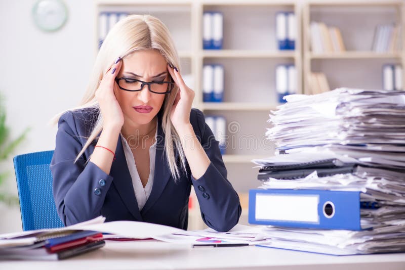 The busy businesswoman working in office at desk royalty free stock photos