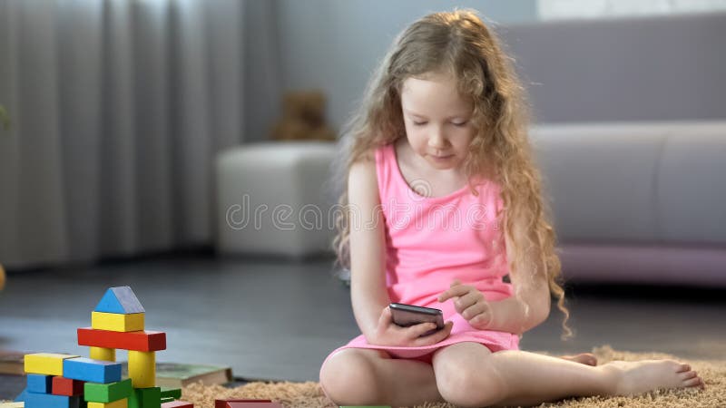 Mobile gadget dependence. Man bearded hipster play smartphone while  girlfriend relaxing near. Internet surfing and social networks. Mobile  internet addiction. Husband addicted internet online games Stock Photo -  Alamy