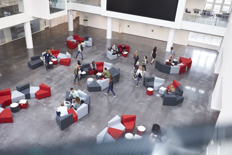Busy university atrium area, seen from an indoor balcony royalty free stock photos