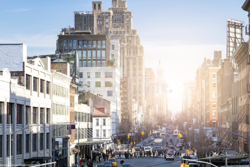 Busy view of 14th Street with crowds of people in Chelsea New York City. Busy view of 14th Street with crowds of people and sunlight background scene from the royalty free stock photos Busy view of 14th Street with crowds of people in Chelsea New York City. Busy view of 14th Street with crowds of people and sunlight background scene from the royalty free stock photos