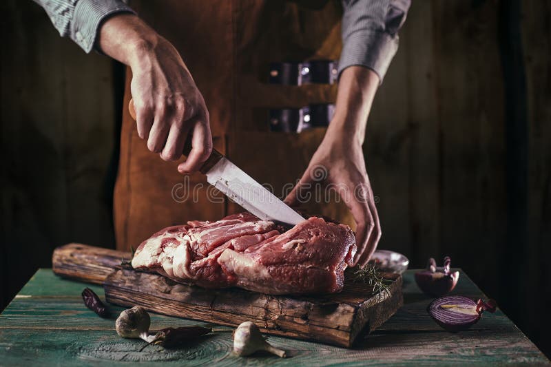 https://thumbs.dreamstime.com/b/butcher-leather-apron-cuts-large-piece-meat-wooden-board-butcher-leather-apron-cuts-large-piece-meat-207333716.jpg