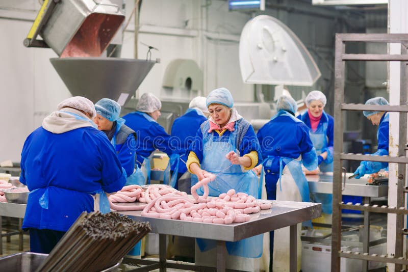 Butchers Processing Sausages At A Meat Factory. Stock Image - Image Of ...