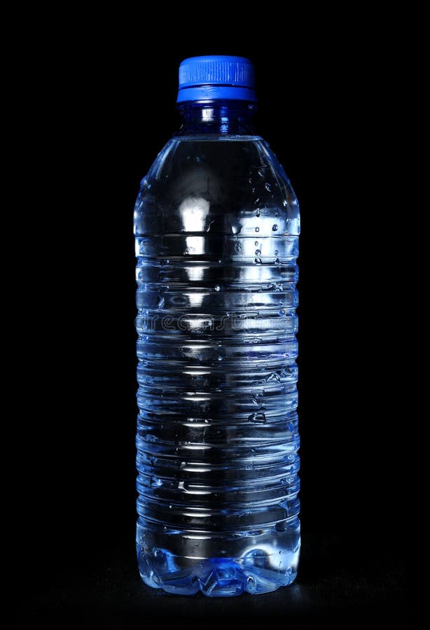 Bottled water with droplets over a black background. Bottled water with droplets over a black background