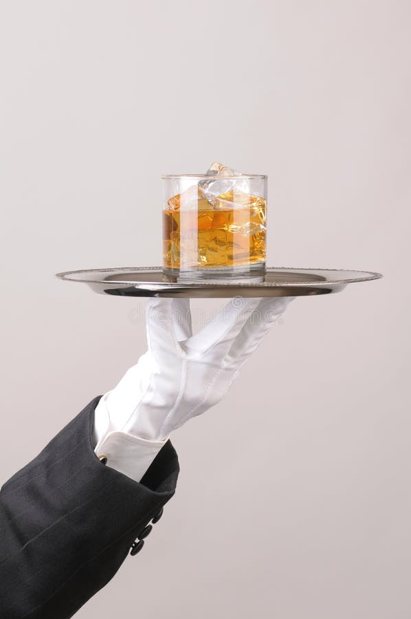 A Hand Holding A Silver Tray With A Cocktail Stock Photo Image of