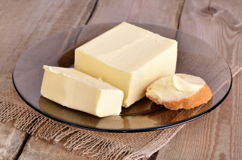 Butter and bread on plate stock photo. Image of creamy 39598154