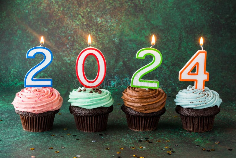 Buttercream Frosted Cupcakes with Number Candles for the New Year 2024