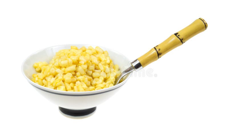 Buttered corn in bowl with spoon stock photography Buttered corn in bowl with spoon stock photography