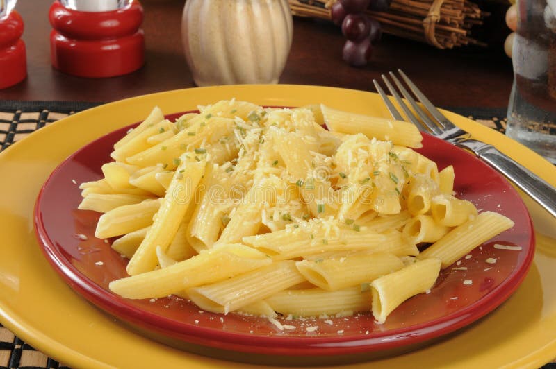 Buttered penne rigate noodles with parmesan cheese