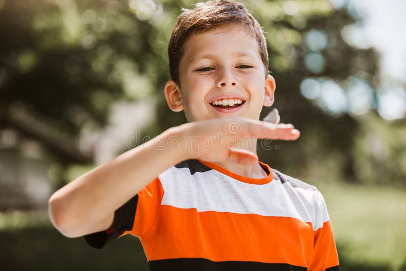 Butterfly in a child`s hand. butterfly on a child`s palm. royalty free stock photo