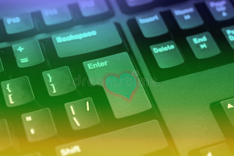 Button on the black keyboard with a heart enter online love royalty free stock images Button on the black keyboard with a heart enter online love royalty free stock images