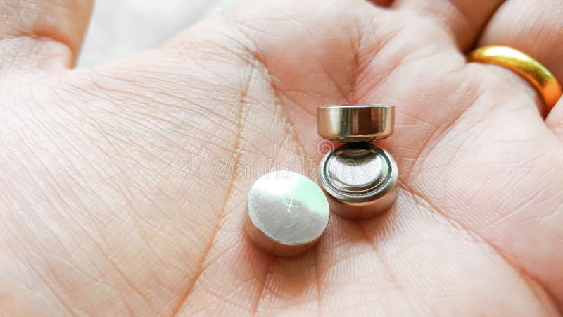 Button cell battery on hand