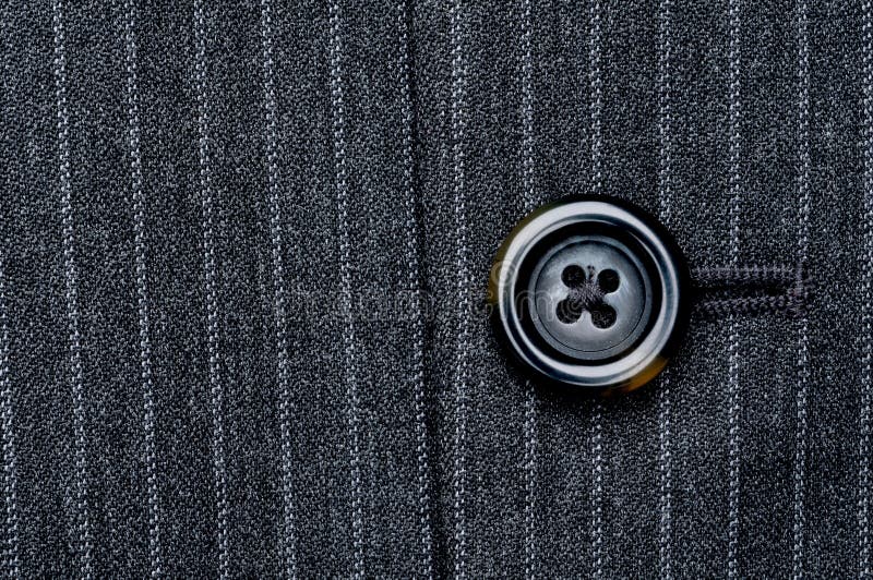 Close up of a button on a pin striped business suit coat. Button clasp stock images, royalty-free photos and pictures