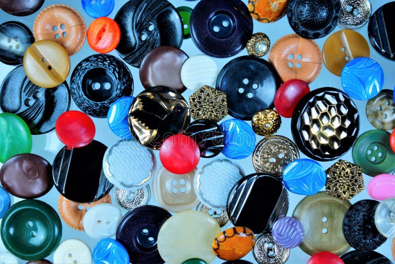 Buttons background for the design and creativity of the tailor. Button clasp on clothing, for the connection of its parts, odevaetsya in the loop. Buttons are attached to clothes, shoes, bags. Button clasp stock images, royalty-free photos and pictures