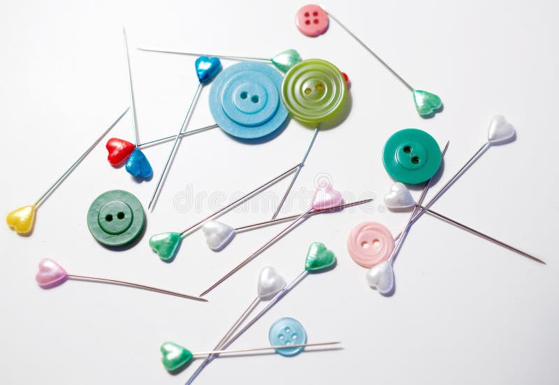 Buttons, Pins And Needles With Threads On Cotton And Jeans Clothes