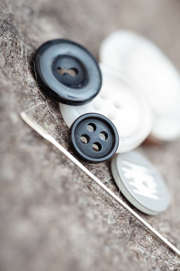 Buttons and sewing needle stock image. Image of black 24043619