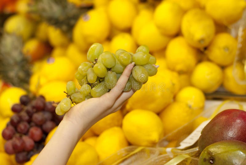 Buying grapes in a supermarket