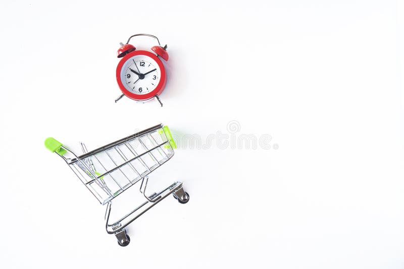 Buying Time. Buy Few More Hours. a Clock in Shopping Cart Stock Photo