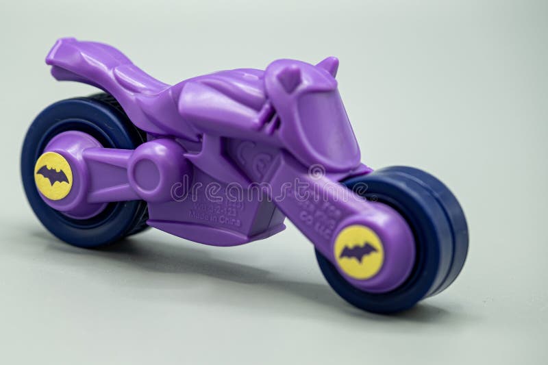 batman bat cycle isolated on gray background. plastic batman bat cycle. Bat cycle die cast replica 1:18 scale from Batman Movie. violet color plastic bat cycle, the logo is typically depicted in violet or a dark shade of violet to complement Batman's iconic dark costume. children to play batman. batman bat cycle isolated on gray background. plastic batman bat cycle. Bat cycle die cast replica 1:18 scale from Batman Movie. violet color plastic bat cycle, the logo is typically depicted in violet or a dark shade of violet to complement Batman's iconic dark costume. children to play batman.