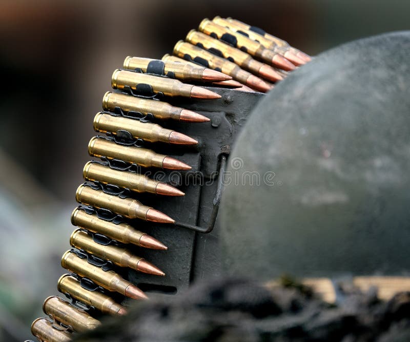 Yorkshire wartime experience. Leeds. UK. August 2021. Belt of brass cased machine gun rounds. Cartridges using metal clips. Yorkshire wartime experience. Leeds. UK. August 2021. Belt of brass cased machine gun rounds. Cartridges using metal clips.