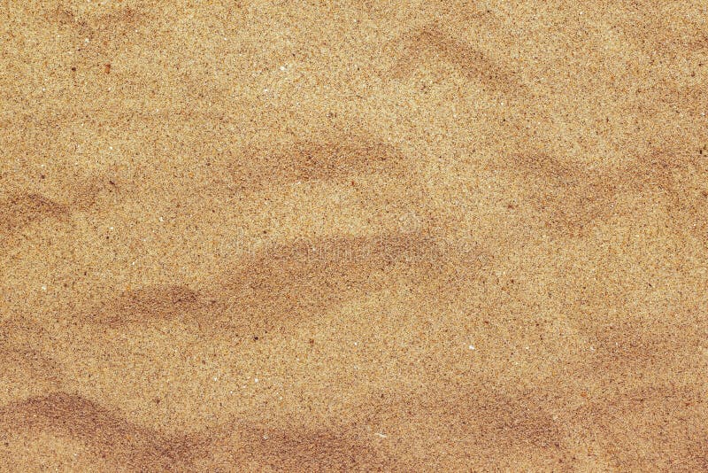 Bästa sikt av brun strandsandtextur, bakgrund för sommarferie arkivfoto Bästa sikt av brun strandsandtextur, bakgrund för sommarferie arkivfoto