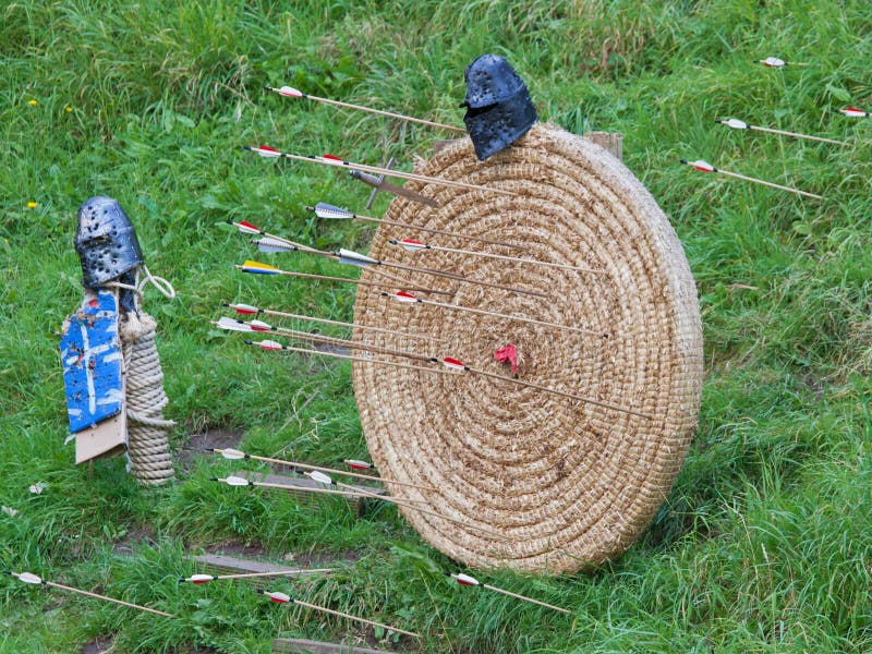 A traditional European archery target and arrows. A traditional European archery target and arrows