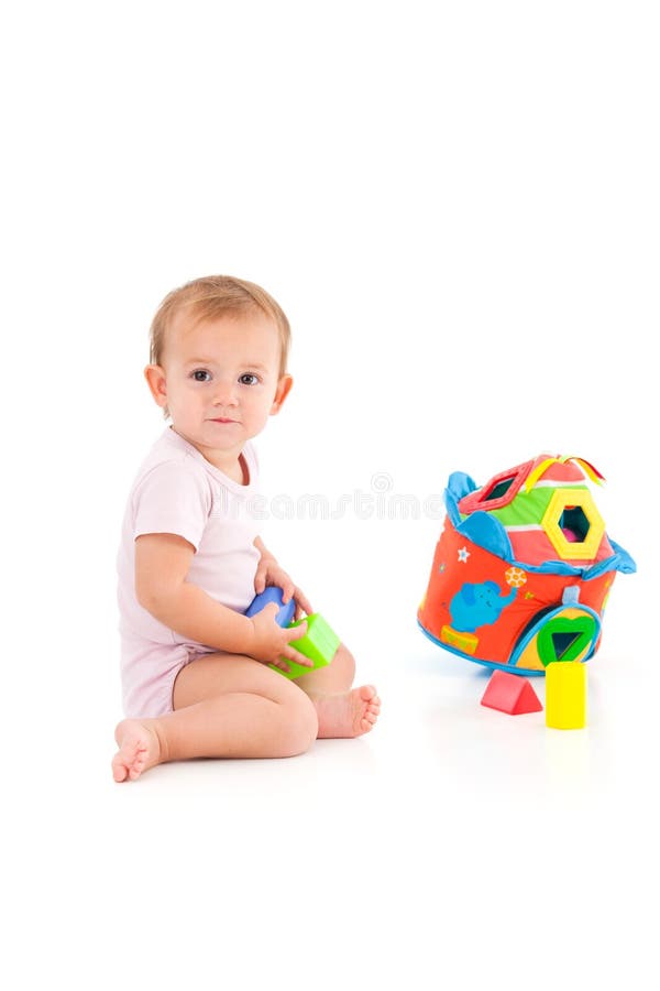 Bébé adorable jouant sur le plancher image stock Bébé adorable jouant sur le plancher image stock