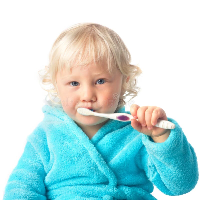 Bébé garçon mignon avec la brosse à dents images stock Bébé garçon mignon avec la brosse à dents images stock