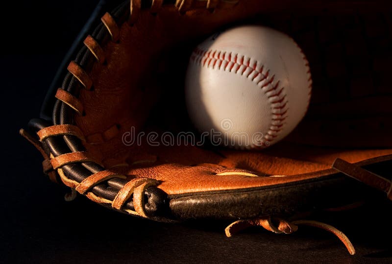 Baseball glove and ball on black. Baseball glove and ball on black