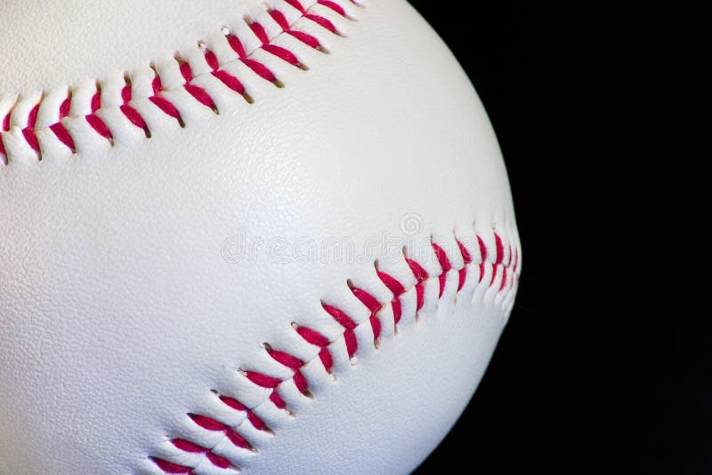 A baseball on a black background. A baseball on a black background