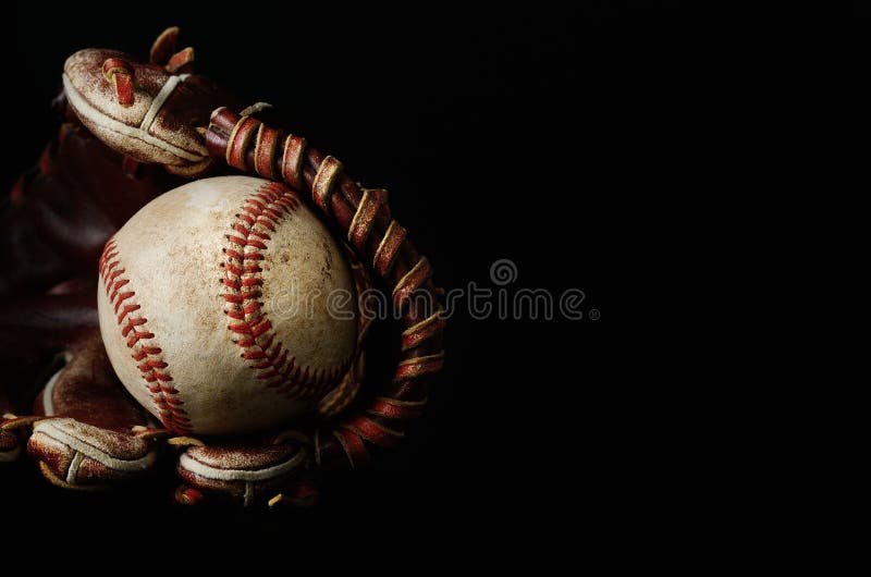 Close up of a baseball glove over a black background. Close up of a baseball glove over a black background