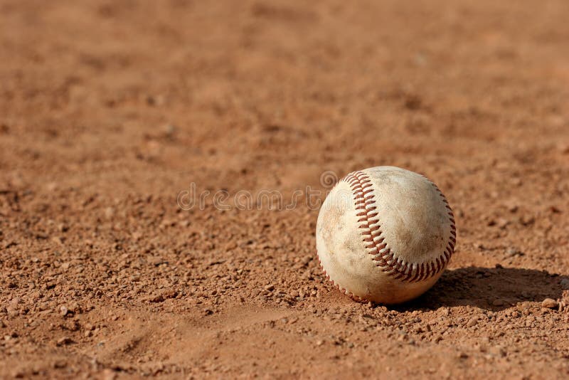 Macro of a baseball lost on the field. Macro of a baseball lost on the field