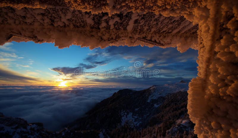 Mountain landscape. Winter, icy snow and sunrise. Spectacular sunrise in Ceahlau mountains, landmark attraction in Romania. Mountain landscape. Winter, icy snow and sunrise. Spectacular sunrise in Ceahlau mountains, landmark attraction in Romania