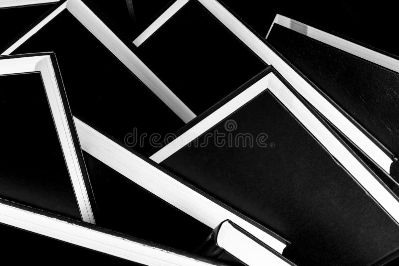 Books piled on top of each other, black and white photography. Books piled on top of each other, black and white photography