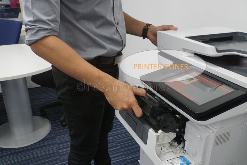 Close up office printer run out of ink and required toner cartridge put by businessman. Close up office printer run out of ink and required toner cartridge put by businessman