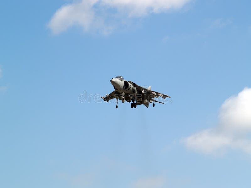 Harrier hovering high in the sky gear down. Harrier hovering high in the sky gear down