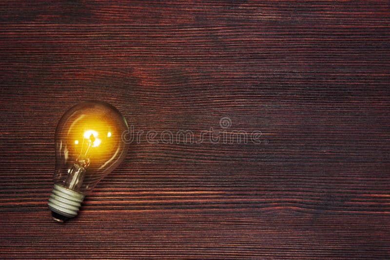 Creative energy and power of new ideas, innovation and creativity with hand holding light bulb, retro toned image, selective focus. Creative energy and power of new ideas, innovation and creativity with hand holding light bulb, retro toned image, selective focus.