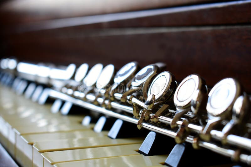 C flute laying on piano keys stock image C flute laying on piano keys stock image