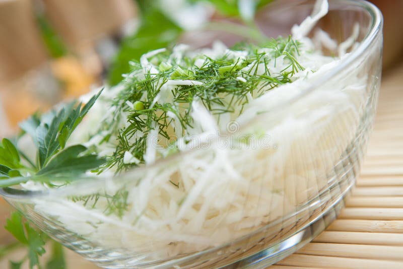 Cabbage salad close-up in a transparent bowl