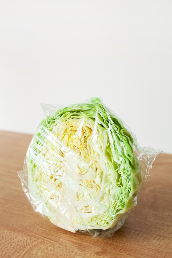 Cabbage Vegetable in Plastic Bag. Single Use Plastic Packaging Issue