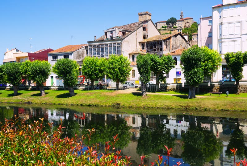 Cabe river and old houses at Monforte de Lemos in summer day. Galicia