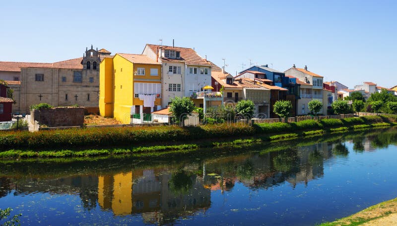 Cabe river and old houses at Monforte de Lemos in summer day. Galicia