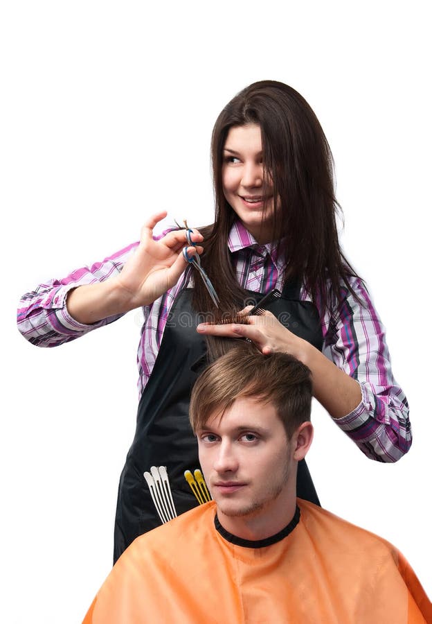 Mão de menina segurando o secador de cabelo.