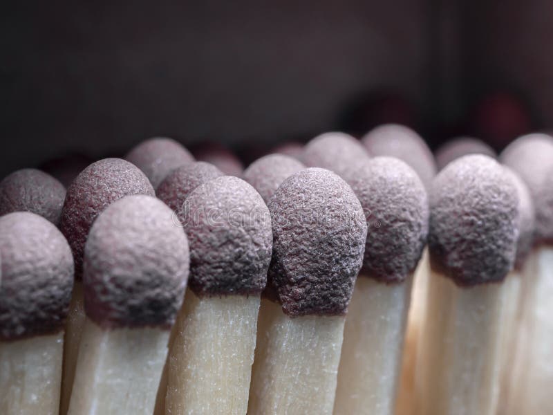Heads of wooden matchsticks in an matchbox . Close-up. Heads of wooden matchsticks in an matchbox . Close-up