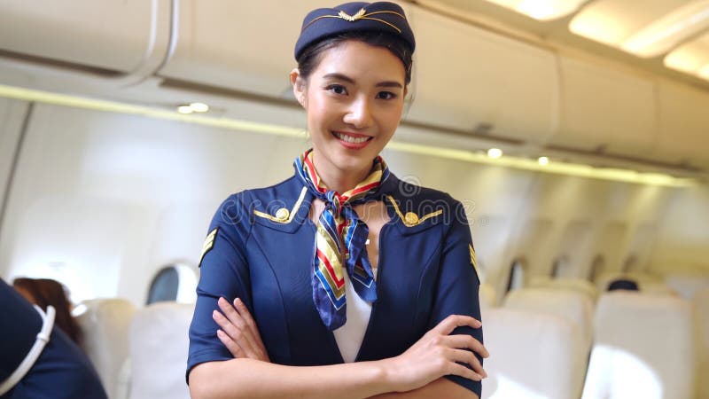 Cabin Crew or Air Hostess Working in Airplane Stock Image - Image of ...