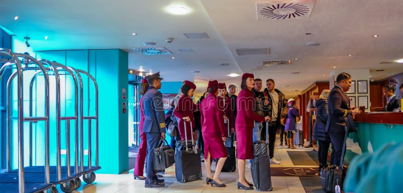 Cabin crew checking into their overnight stop off. Shows crew queing up to check in stock photo Cabin crew checking into their overnight stop off. Shows crew queing up to check in stock photo