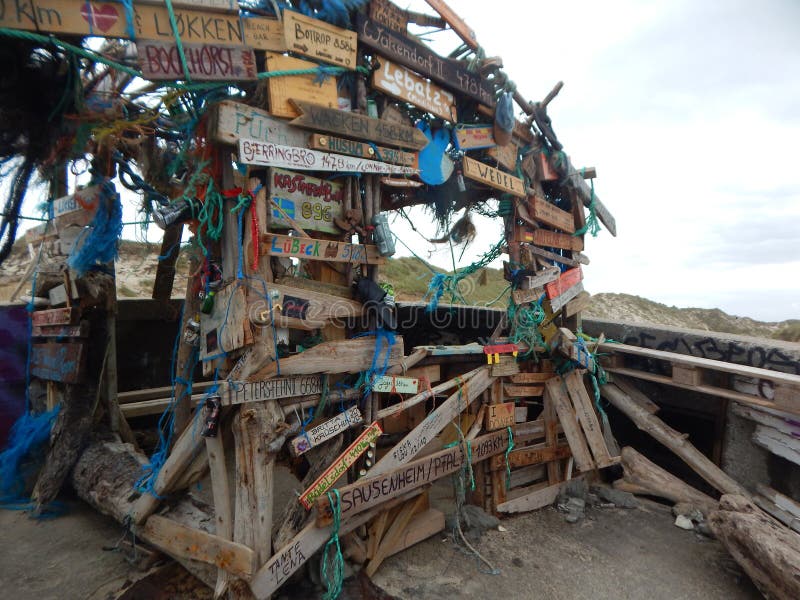 Cabin made of driftwood on old bunker stock photography